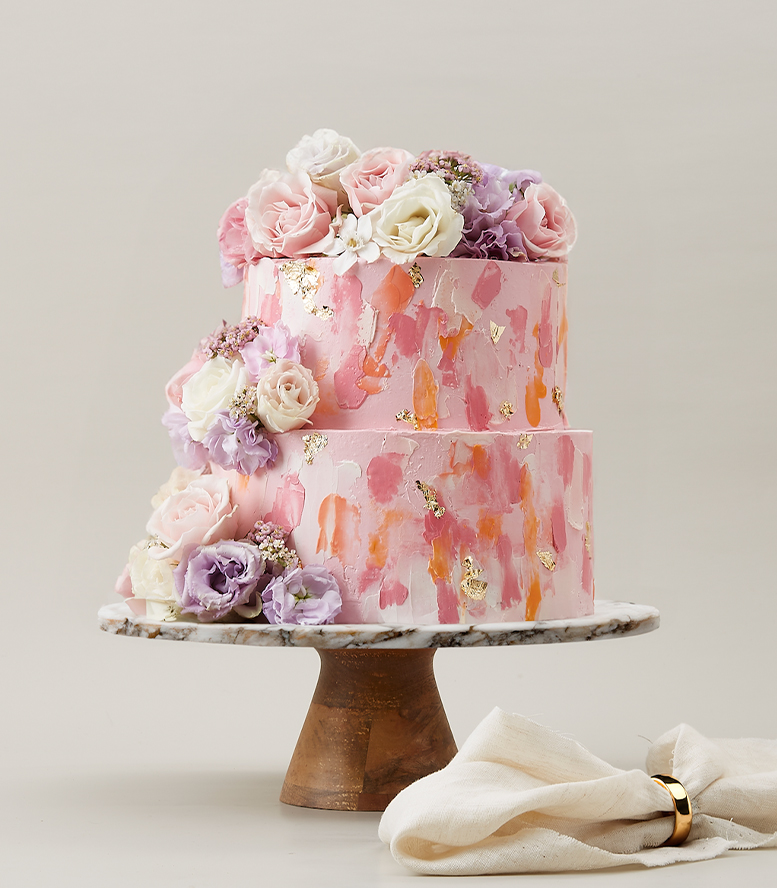 Pink 2-Tier Cake Decorated with Flowers on Top