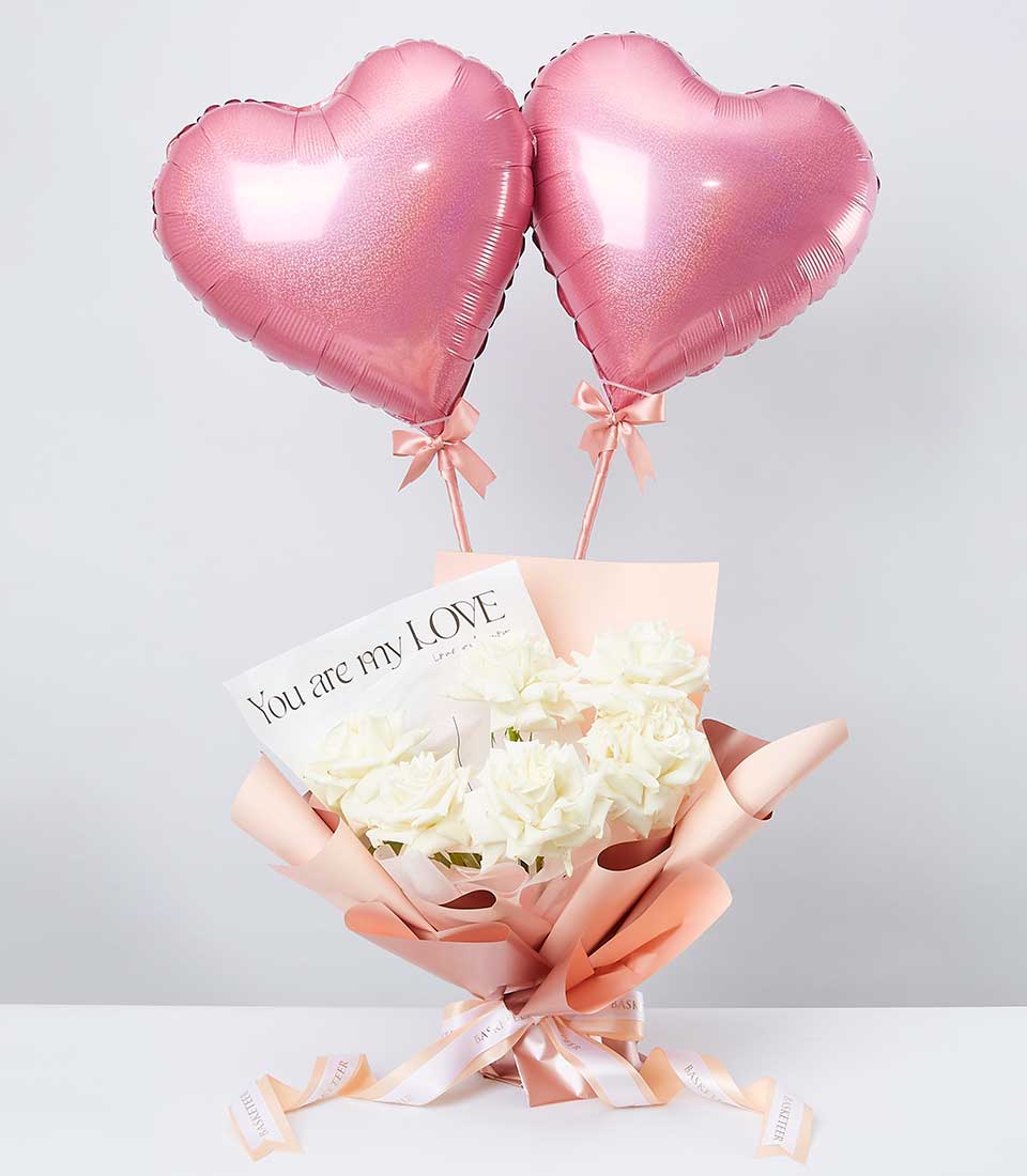 Celebrate special moments with our Pink Heart Balloon and White Roses Set. Perfect for birthdays or any occasion, this charming arrangement combines the elegance of white roses with the whimsy of pink heart balloons. Order now to add a touch of joy to your celebrations!