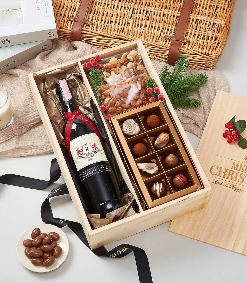 Rochester Pinotage 2022 Wine With Chocolate And Mixed Nuts In The Wood Box With a Black Bow.