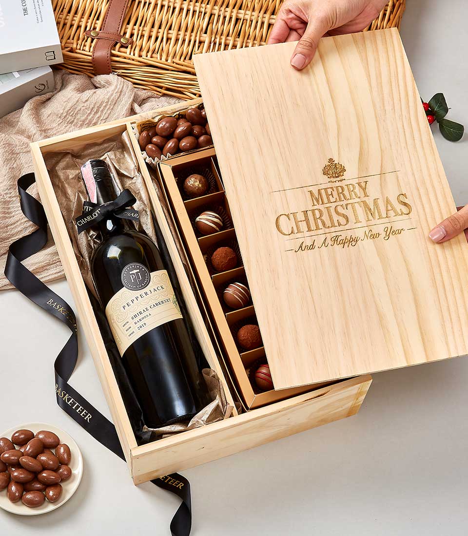 A beautifully crafted wooden gift box from Basketeer, elegantly inscribed with 