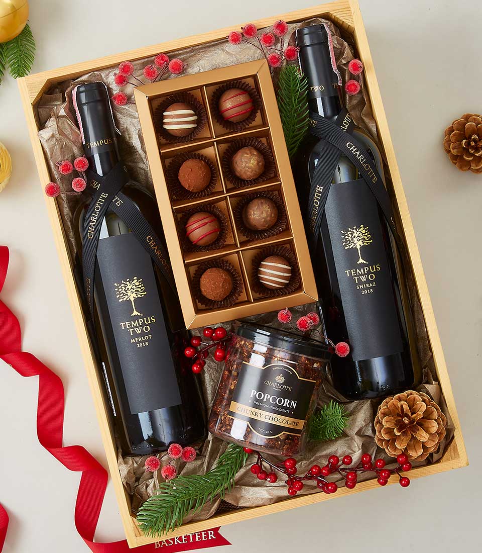 A luxurious wooden gift box from Basketeer elegantly showcases two bottles of exquisite 