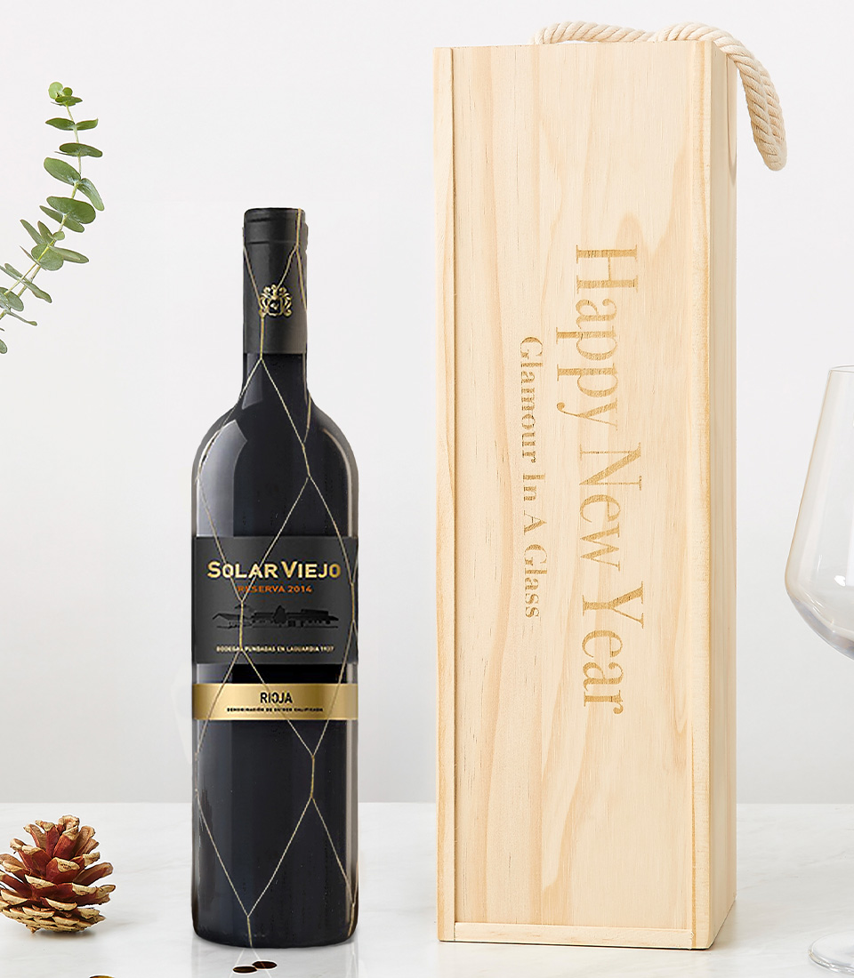 A bottle of Solar Viejo Reserva Rioja wine (2016 vintage) elegantly paired with a personalized wooden wine box engraved with 