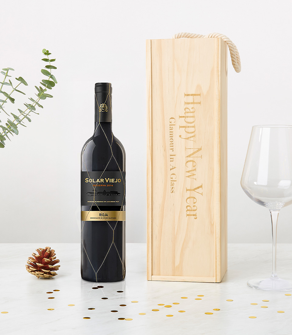 A bottle of Solar Viejo Reserva Rioja wine (2016 vintage) elegantly paired with a personalized wooden wine box engraved with 