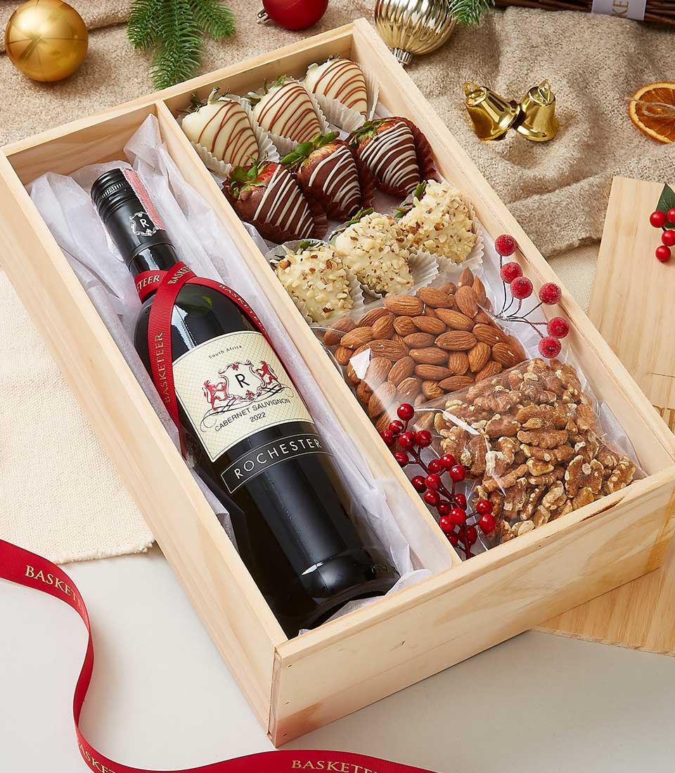 A lavish wooden gift box from Basketeer showcases an exquisite bottle of red wine adorned with a 