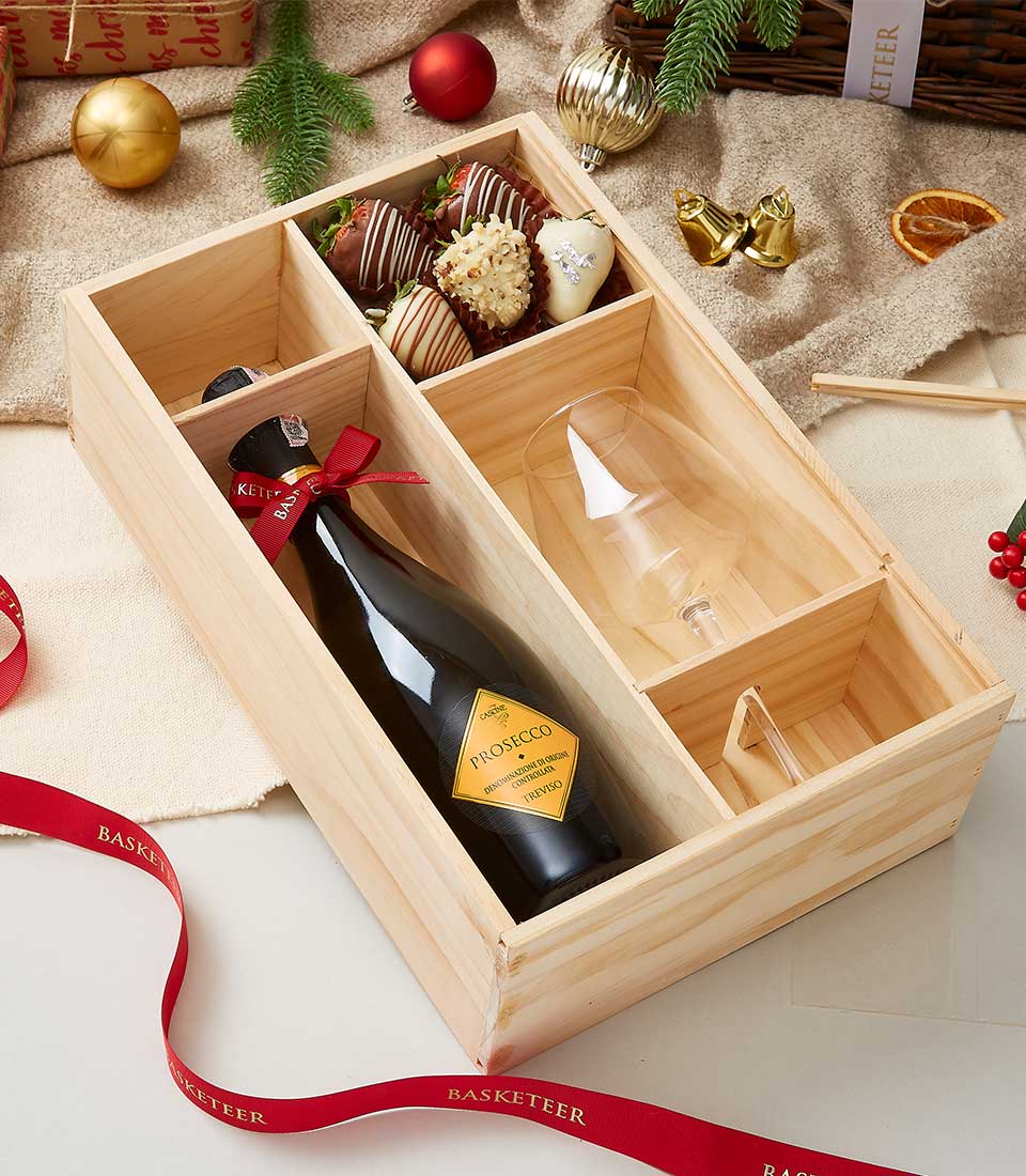 wine, chocolate-covered strawberries and Glass in a wooden gift box