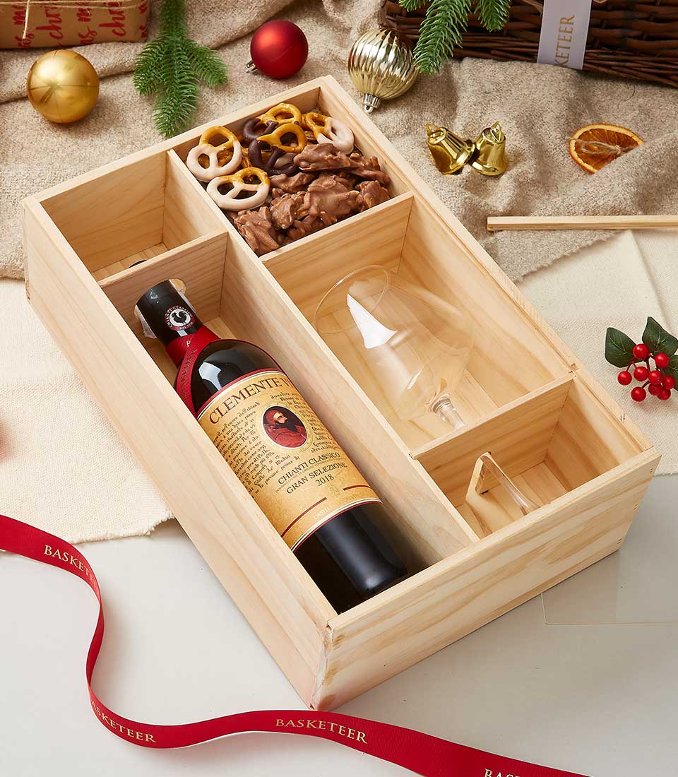 wine, chocolate-covered strawberries, and nuts in a wooden gift box: