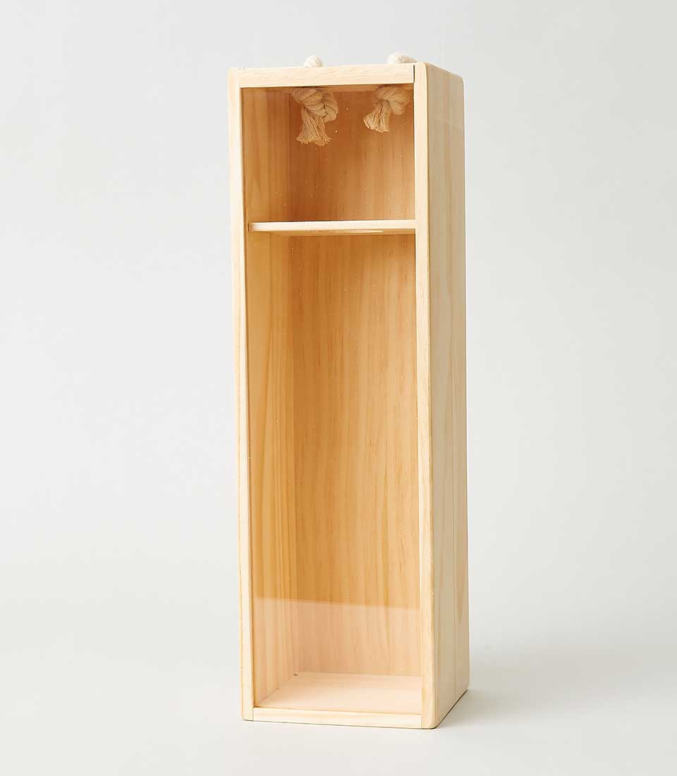 Experience the epitome of luxury with Basketeer. This tall, rectangular wooden display box boasts an elegant open front and a sophisticated middle shelf for your cherished items. Delicate decorative tassels drape gracefully from the top edge, adding a touch of opulence to its light natural wood finish. Against a pristine white background, the exquisite craftsmanship of Basketeer stands out—perfect for elevating any space with timeless style.