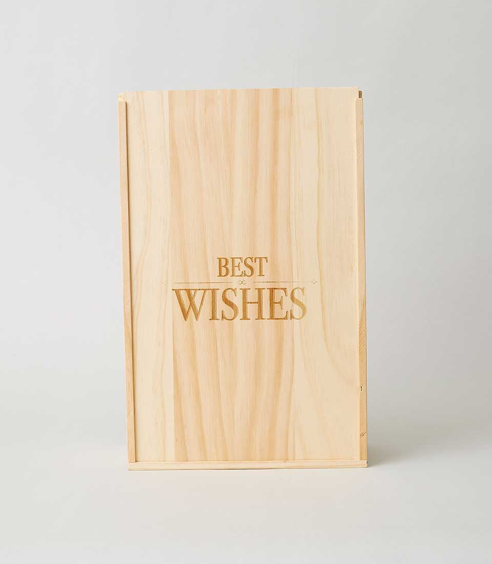 A sophisticated light wooden box, exquisitely engraved with the words 