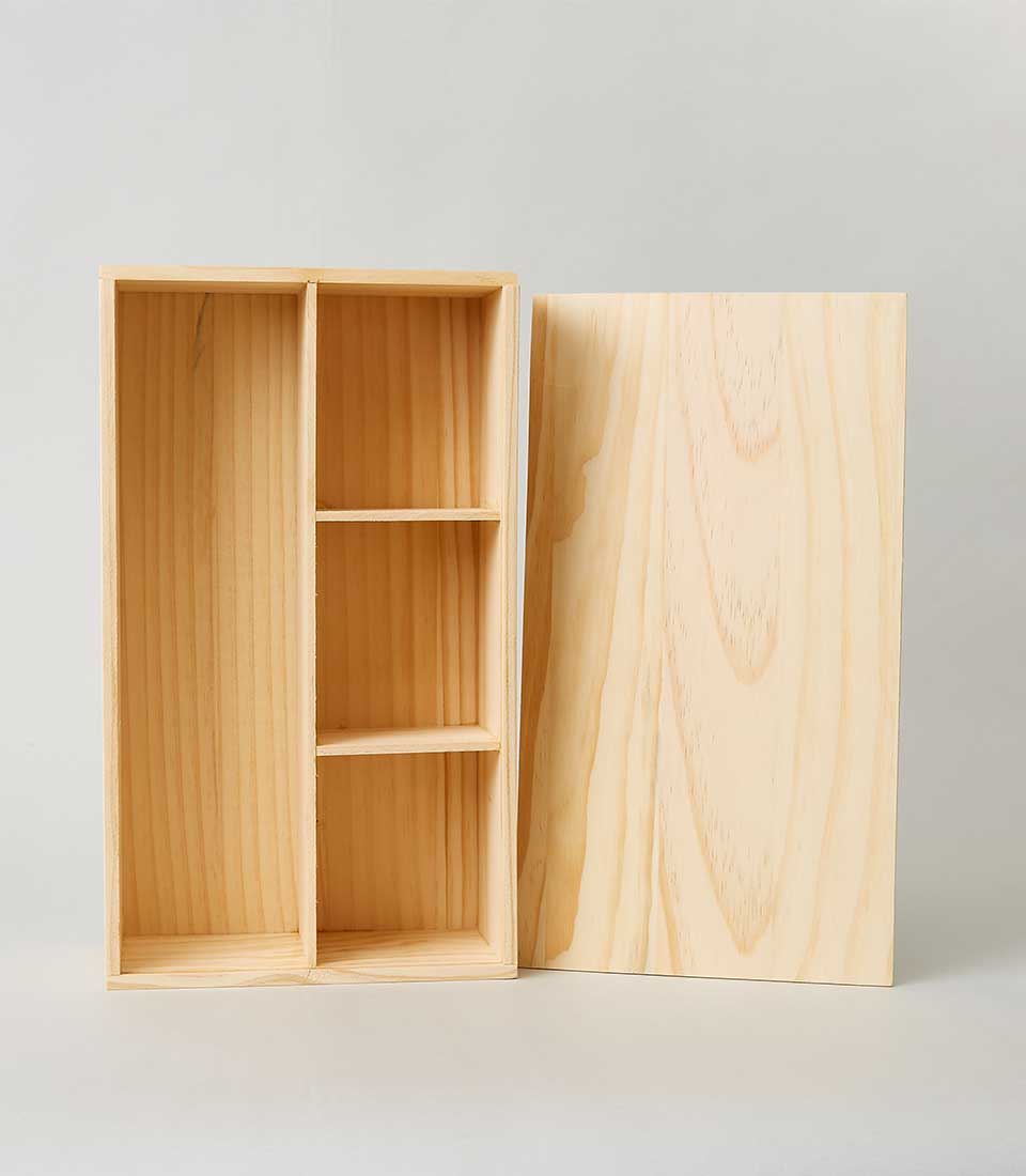 A luxurious wooden box with a removable lid, elegantly crafted to showcase the natural beauty of its wood grain. The box is divided into two vertical compartments; the left side offers a spacious blank section for versatile storage. On the right, three equally-sized, sophisticated shelves provide refined organization. The lid, meticulously engraved with the Basketeer logo, rests gracefully beside the box, completing this exquisite piece of functional elegance.