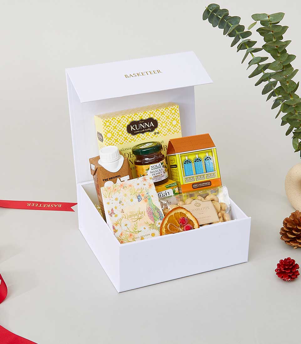 A luxurious white gift box elegantly labeled 