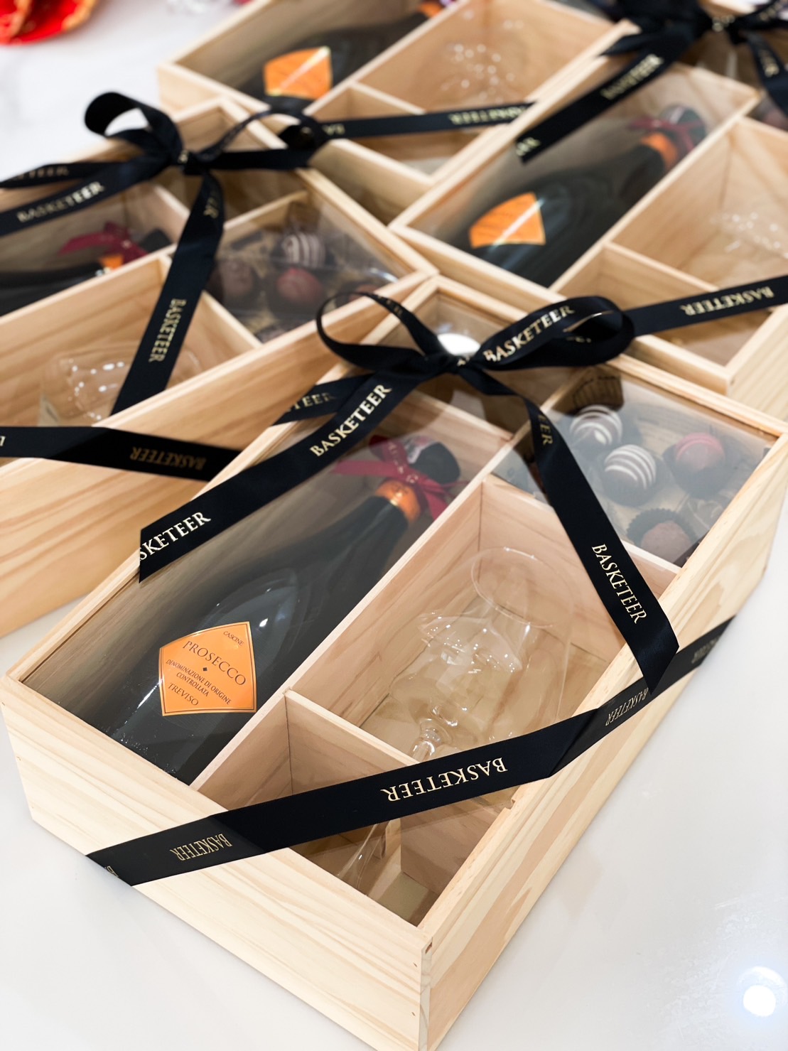 wine, chocolate-covered strawberries and Glass in a wooden gift box