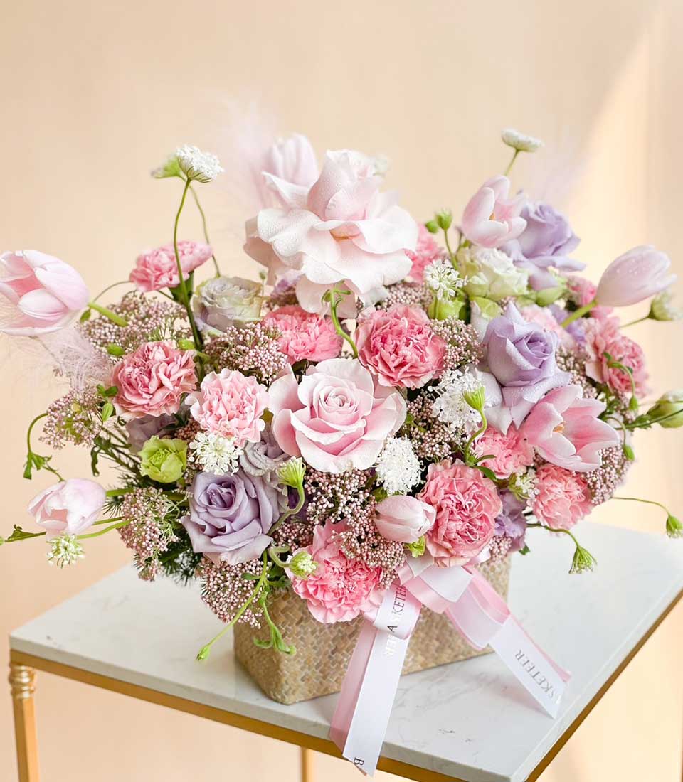 Sweet Pink Flowers And Purple Roses In Basket