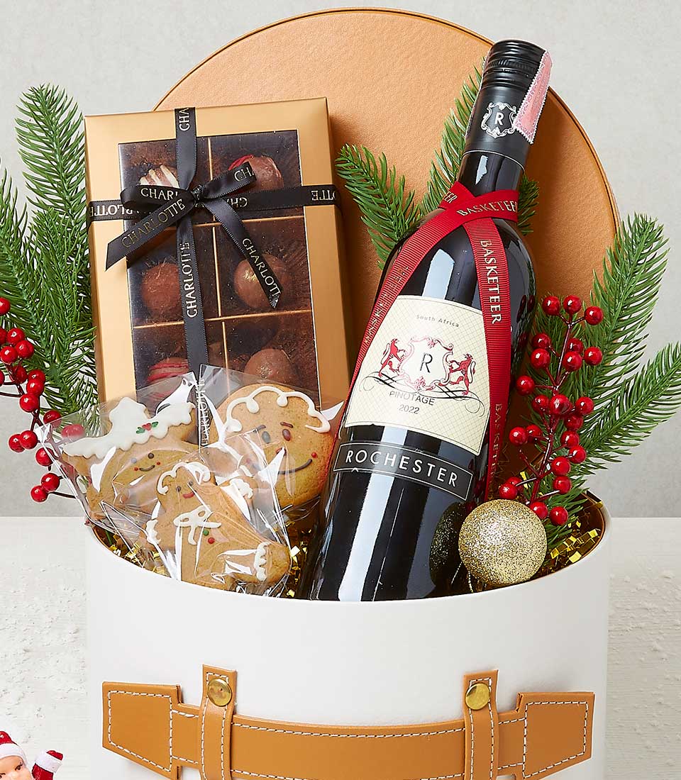 An opulent gift basket curated by Basketeer, showcasing an exquisite bottle of 