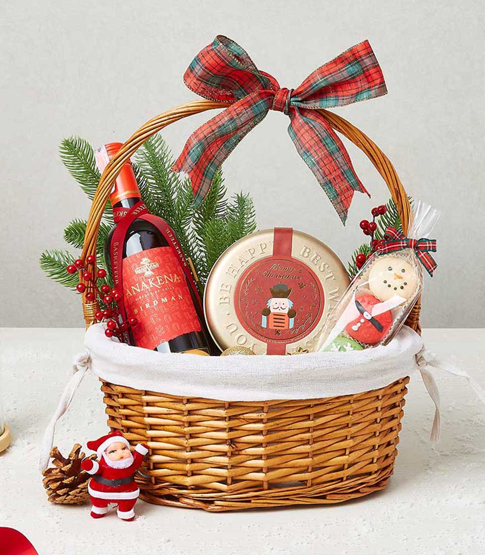 Holiday cheer gift basket with festive cookies, biscuits, and holiday-themed treats in a beautifully wrapped wicker basket.