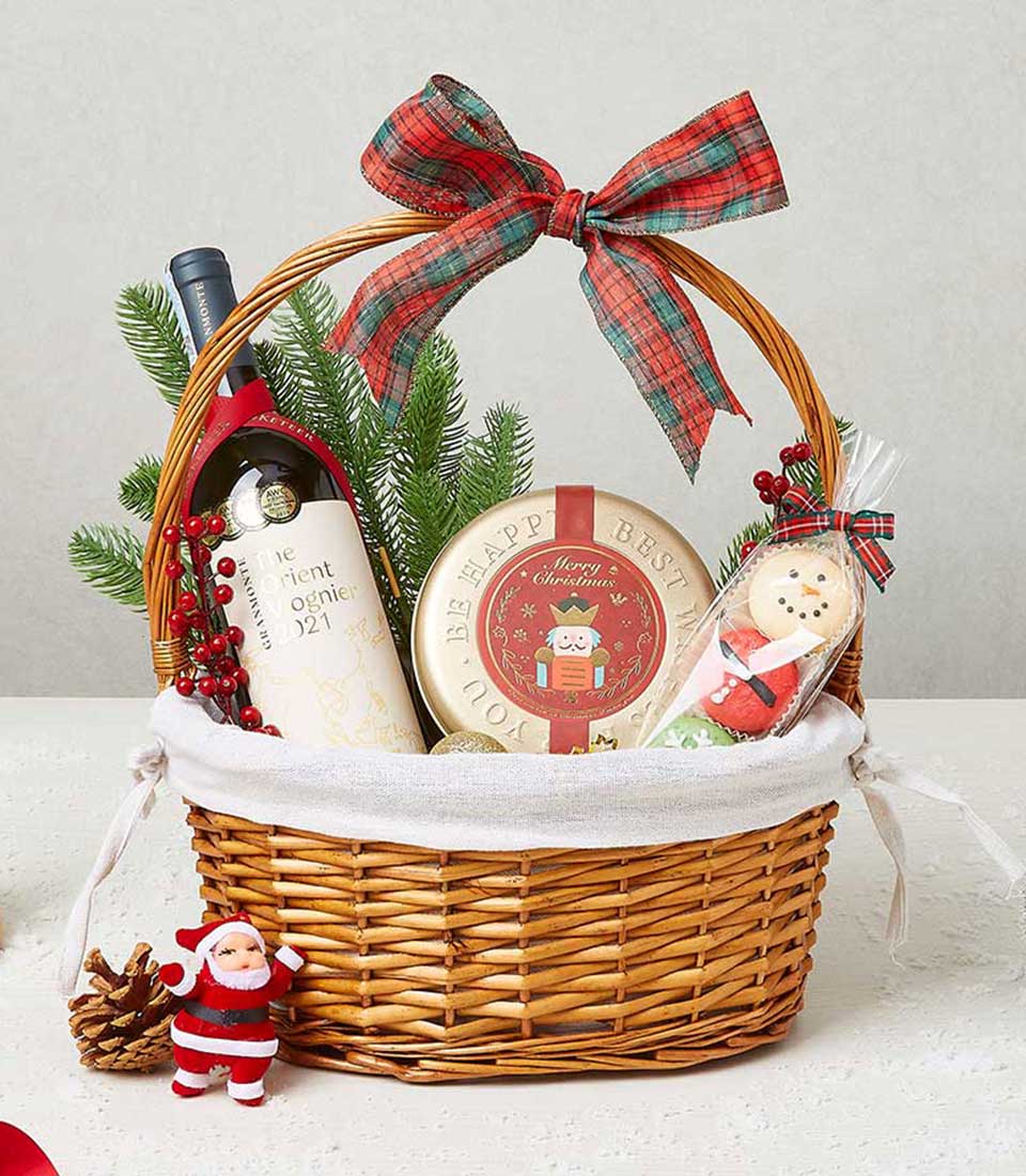 Classic Christmas gift basket with cookies, festive treats, and holiday decorations for seasonal celebrations.
