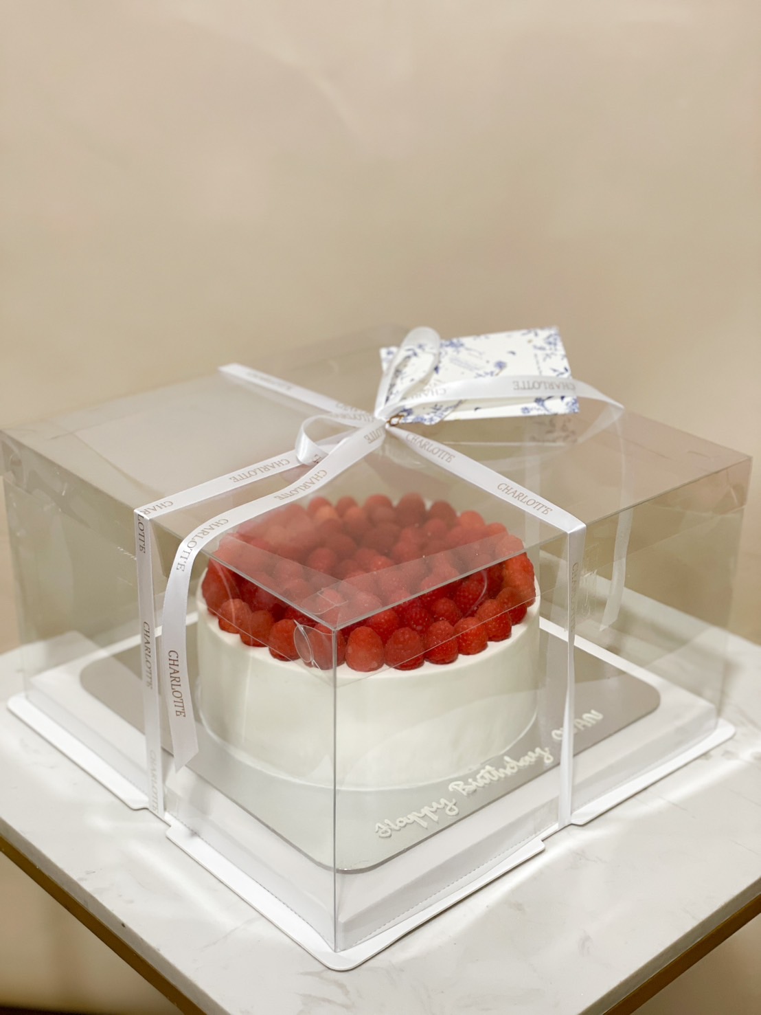 A classic strawberry shortcake with layers of soft sponge, fresh whipped cream, and topped with premium fresh strawberries, elegantly packaged for gifting.