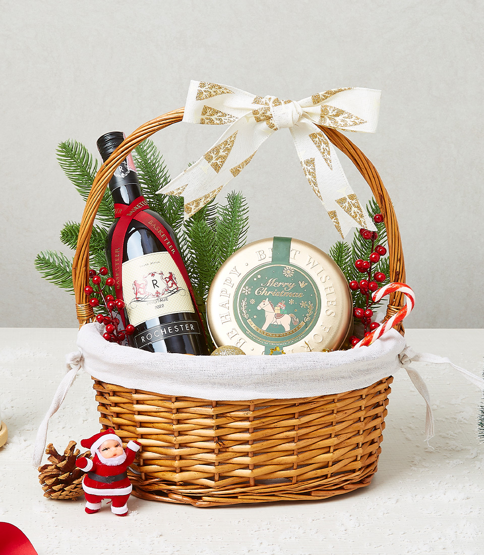 Christmas gift basket with festive cookies, candy canes, and holiday decorations for a joyful celebration.