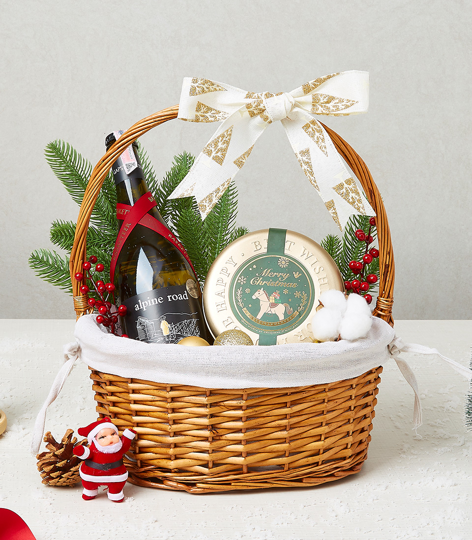 Christmas gift basket with festive cookies, candy canes, and holiday decorations for a joyful celebration.
