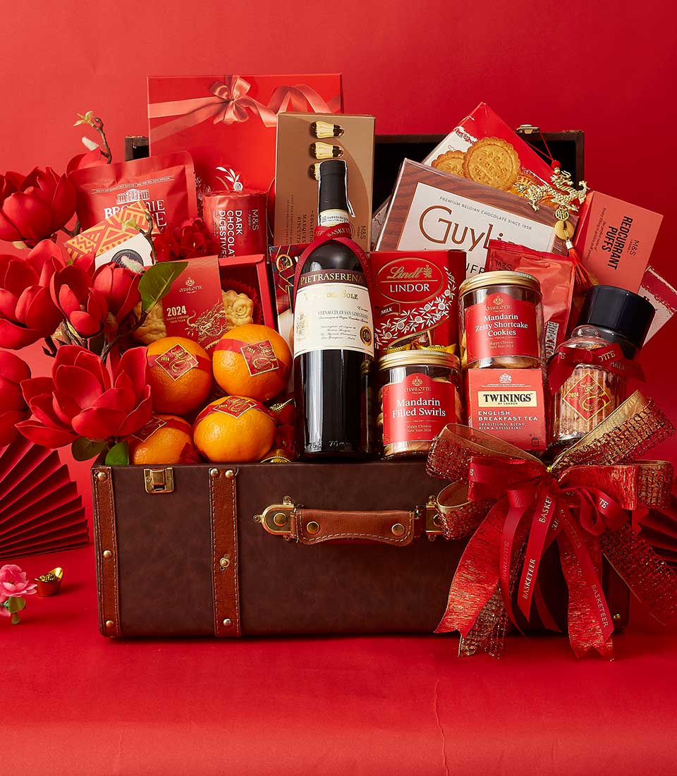 Chinese New Year Gift In Wine, Mandarin Orange, Cookies, Chocolate and Many Treats Delicious In The Brown Hamper We also Decorate it in Red and Gold.