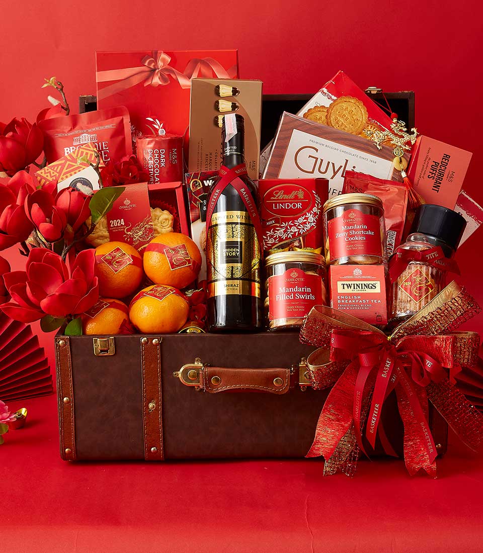 Chinese New Year Gift In Wine, Mandarin Orange, Cookies, Dragon Cookies, Chocolate and Many Treats Delicious In The Brown Hamper We also Decorate it in Red and Gold.