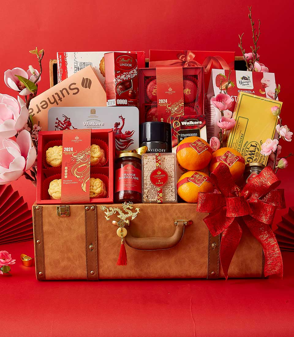 Chinese New Year Gift In Mandarin Orange, Macarons, Dragon Cookies, Honey, Strawberry Jam and Many Treats Delicious In The Brown Hamper We also Decorate it in Red and Gold.