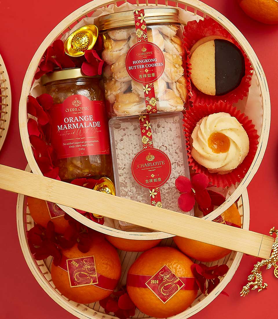 A festive basket arranged with various treats including a jar labeled 