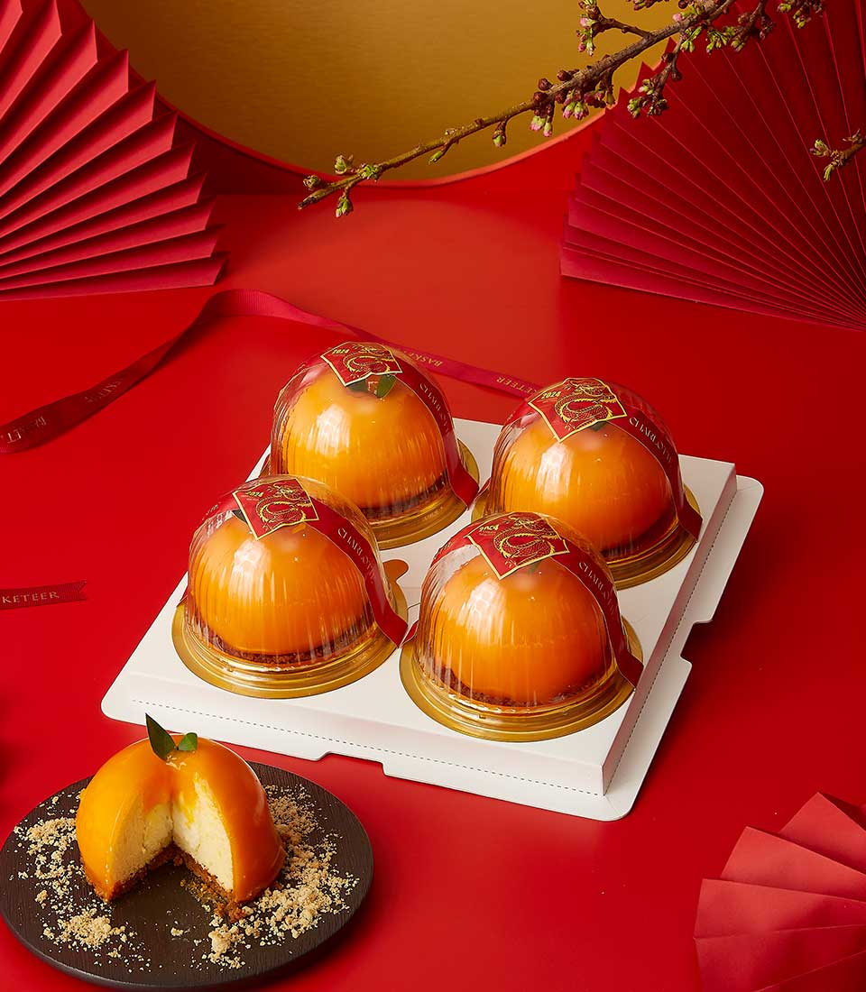 Chinese New Year Sweets Gift In Creamy Mandarin Center Cake Gift Set in a clear box.