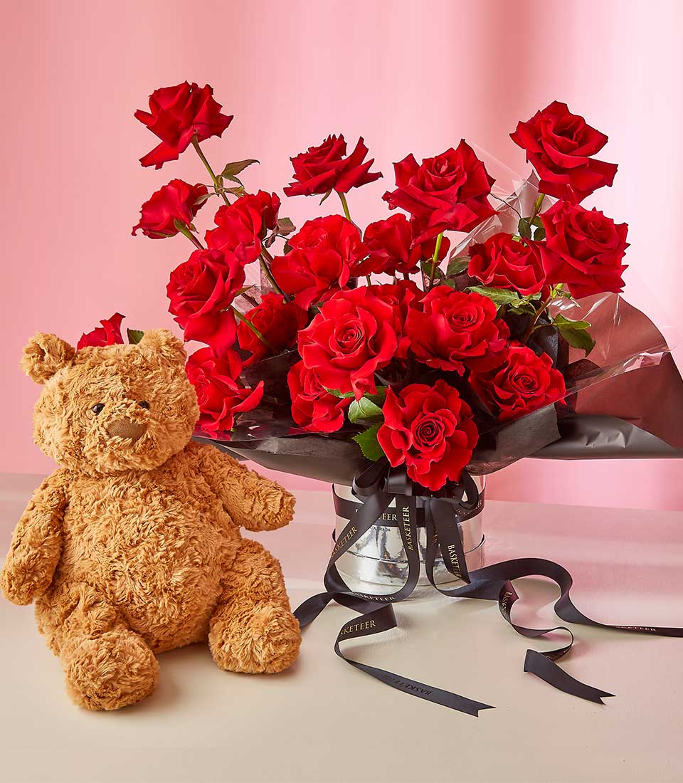 Brighten someone's day with our Radiant Red Roses & Bear Hug Gift. This delightful gift set features vibrant red roses paired with a cuddly teddy bear, perfect for sending warm hugs and affection to your loved ones.