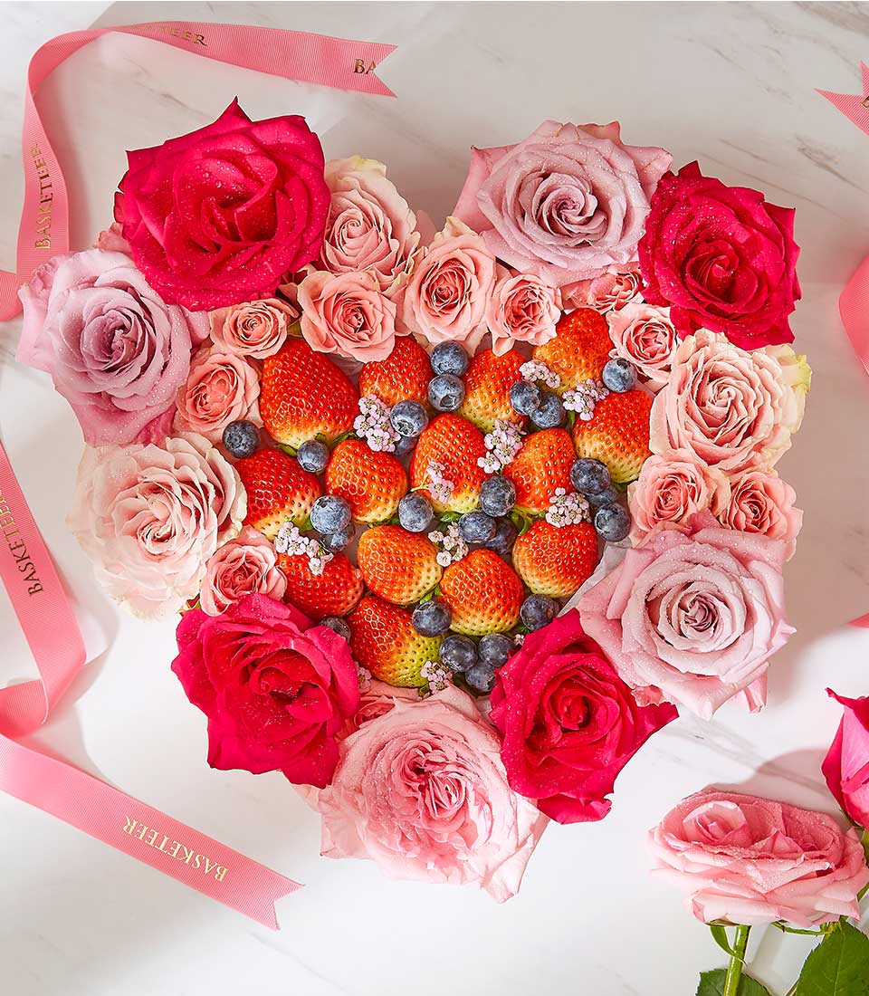 Valentine's Day Sweet Pink Flower with Mixed Berry Fruits In The Heart Box.