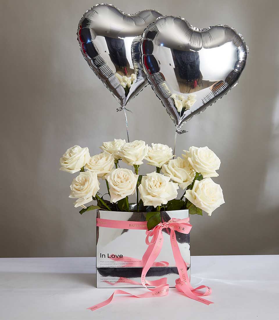 Celebrate love and joy with our exquisite Gray Heart Balloon & Snowy Roses Bouquet Gift. This enchanting arrangement features delicate snowy roses complemented by elegant gray heart balloons, making it a perfect gift for birthdays, Valentine's Day, or any special occasion. Order now and spread happiness!