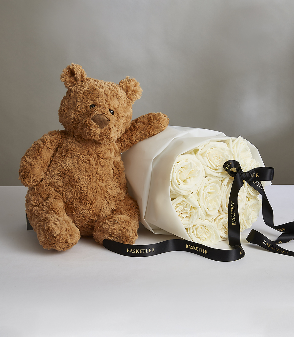 Valentine's White Playa Blanca Roses Bouquet With a Black Bow and Brown Teddy Baer.