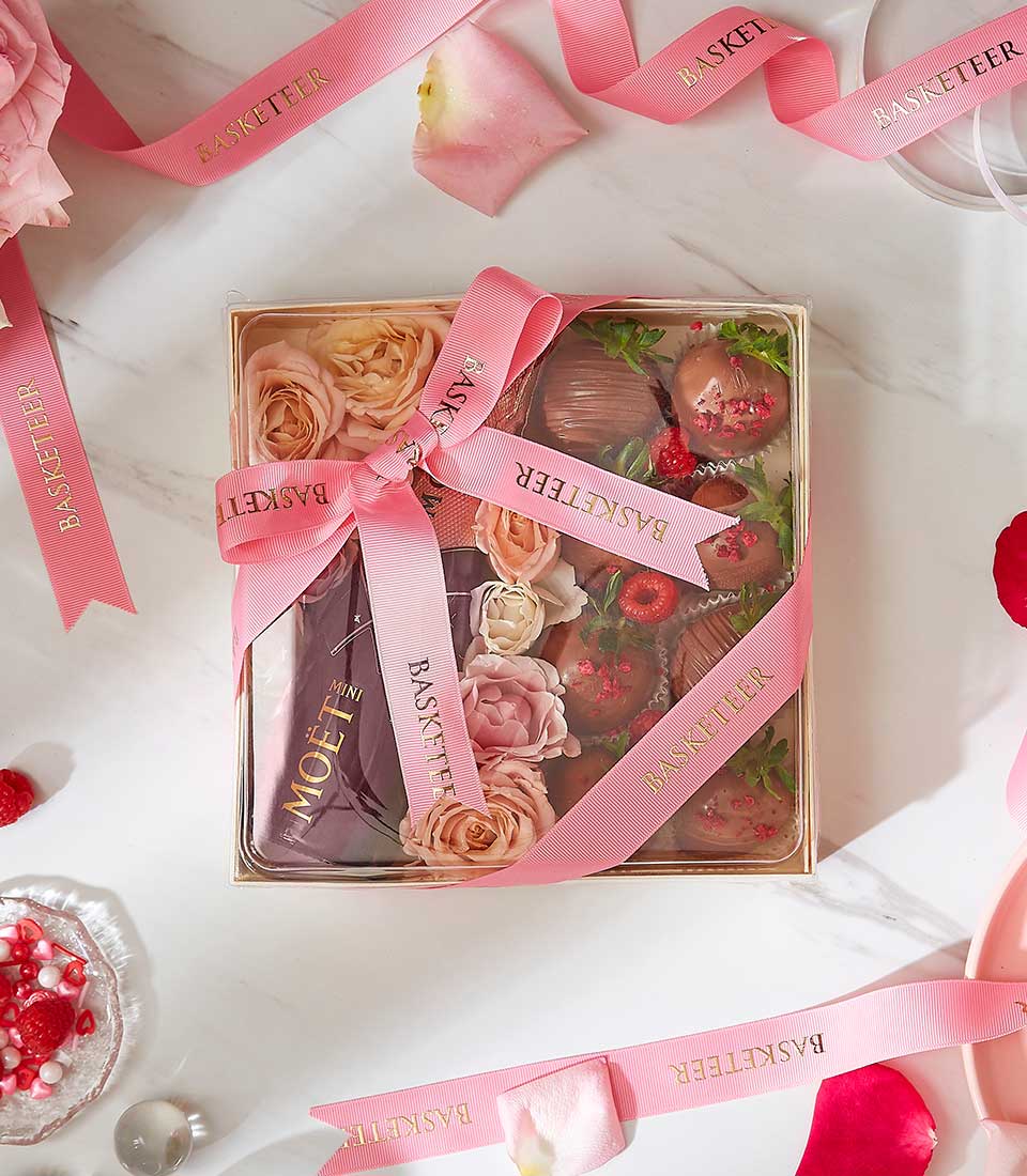 A gift box adorned with pink 