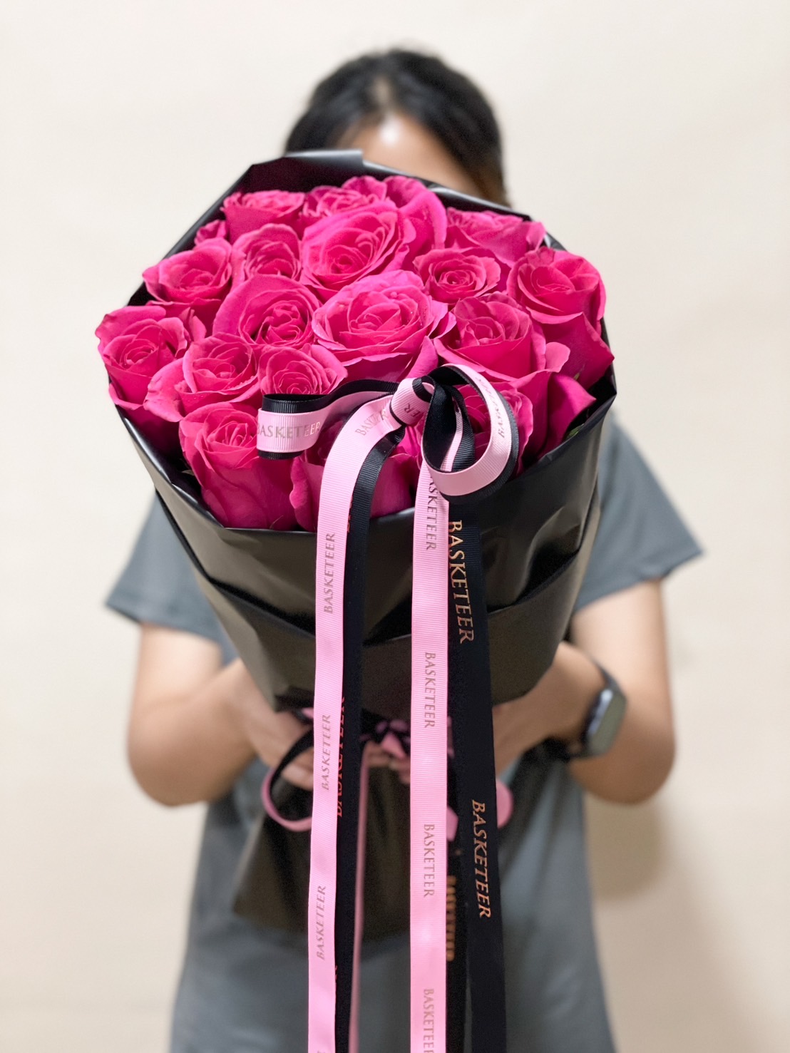 A stunning hot pink rose bouquet wrapped in black paper with elegant pink & black ribbons, perfect for romantic occasions, birthdays, and surprises.