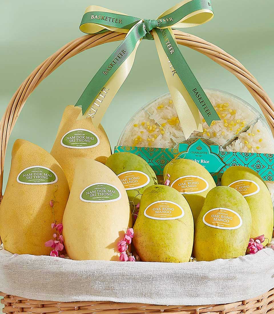 Introducing the *Golden Mango Euphoria Basket*: A wicker basket filled with various mangoes, each labeled with names like 