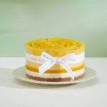 Treat yourself or someone special to our Exotic Mango Layer Cake, a delightful bakery gift bursting with tropical flavor.