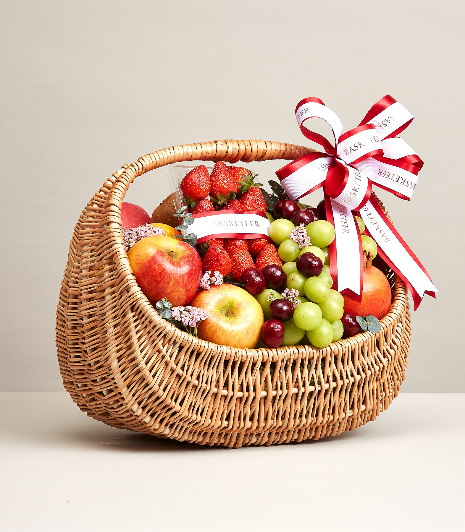 Mixed Fresh Fruit In The Basket With a Bow