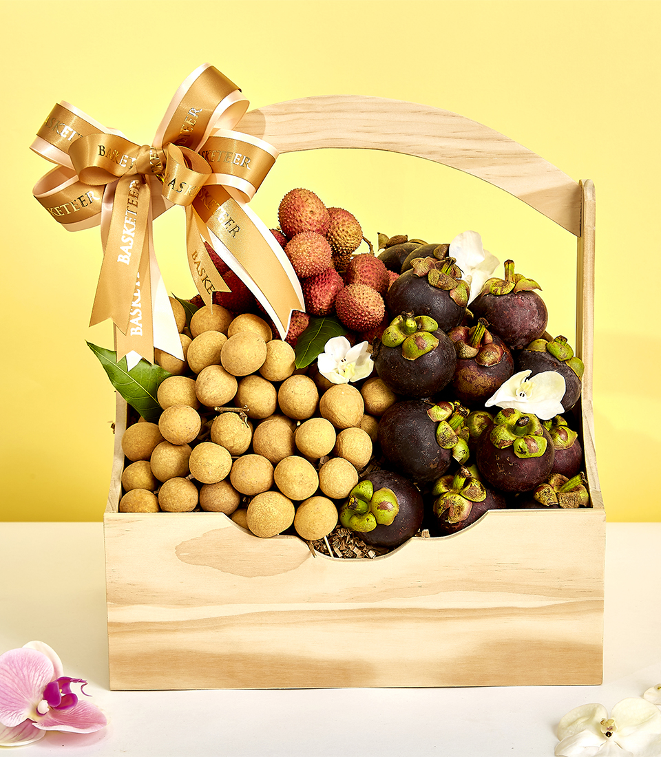 Experience the tropical delights of Thailand with our Exotic Fruit Fusion Basket. Overflowing with the succulent flavors of mangosteens, lychees, and longans, this wooden basket is a vibrant celebration of Thai summer fruits. Order now and savor the essence of paradise!