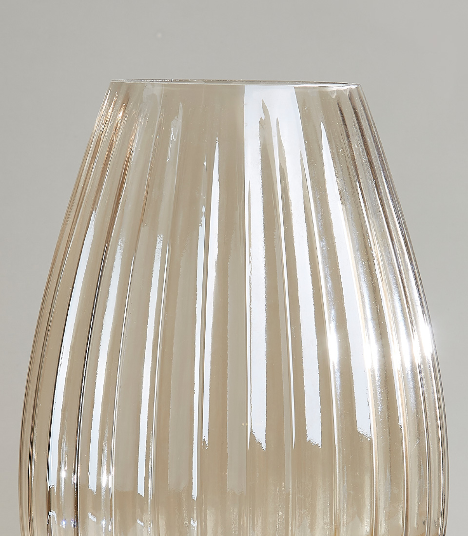 Close-up of Ribbed glass vase featuring a sleek, tapered design and clear finish.