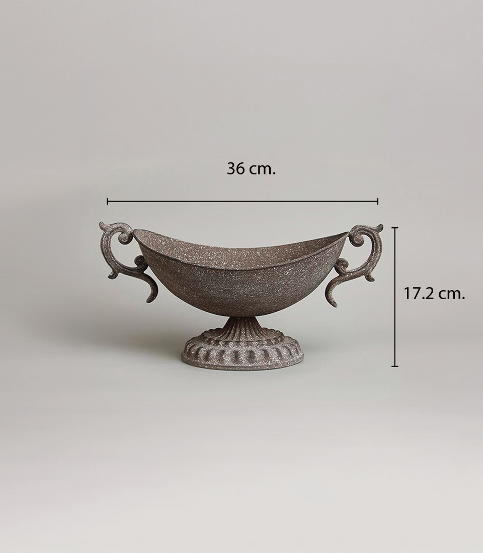 Antique-style brown metal vase with intricate handles and pedestal base, 36 cm wide and 17.2 cm tall, on a light grey background.