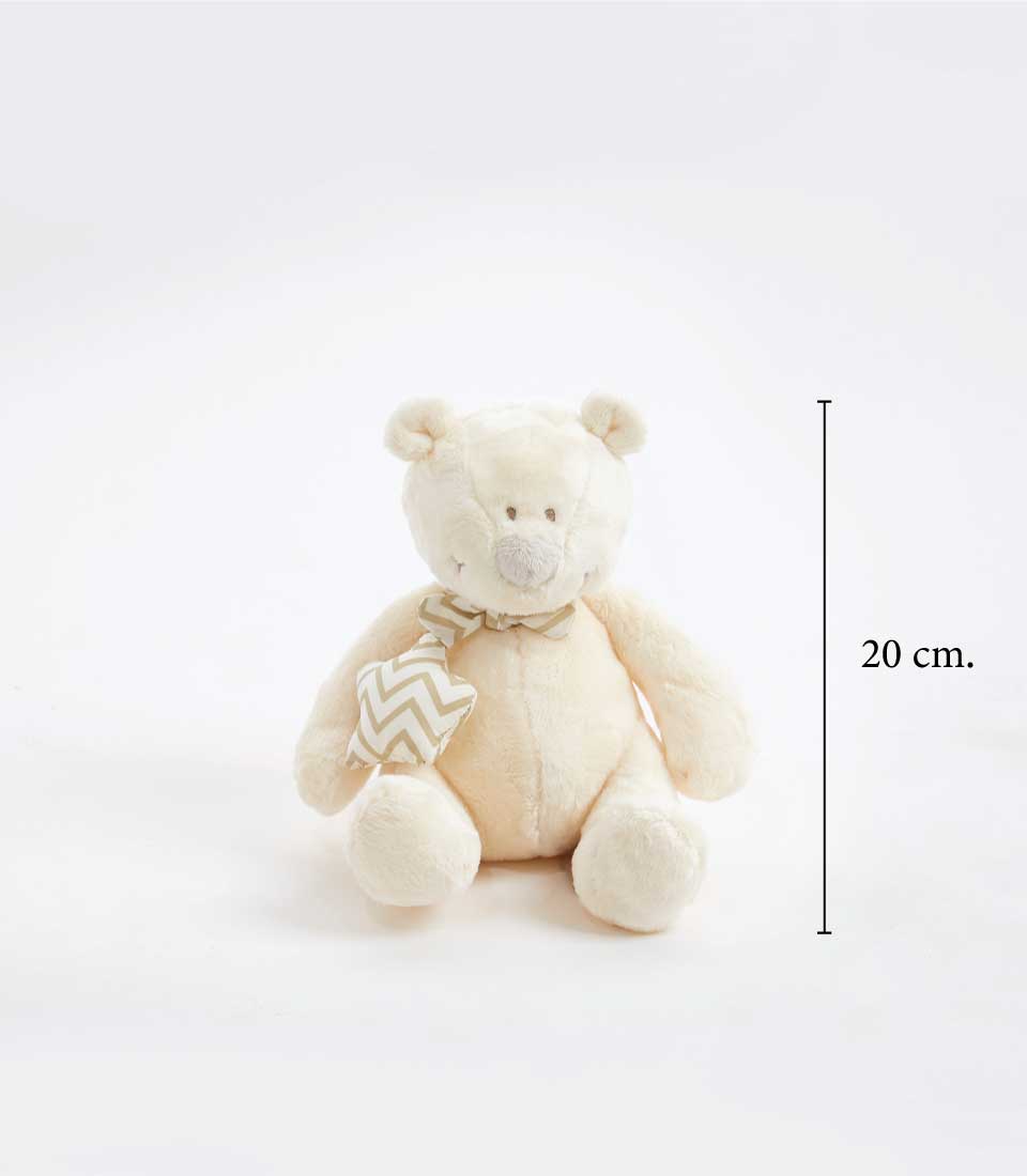 Soft cream-colored teddy bear with a chevron-patterned scarf around its neck on a white background, height of 20 cm.