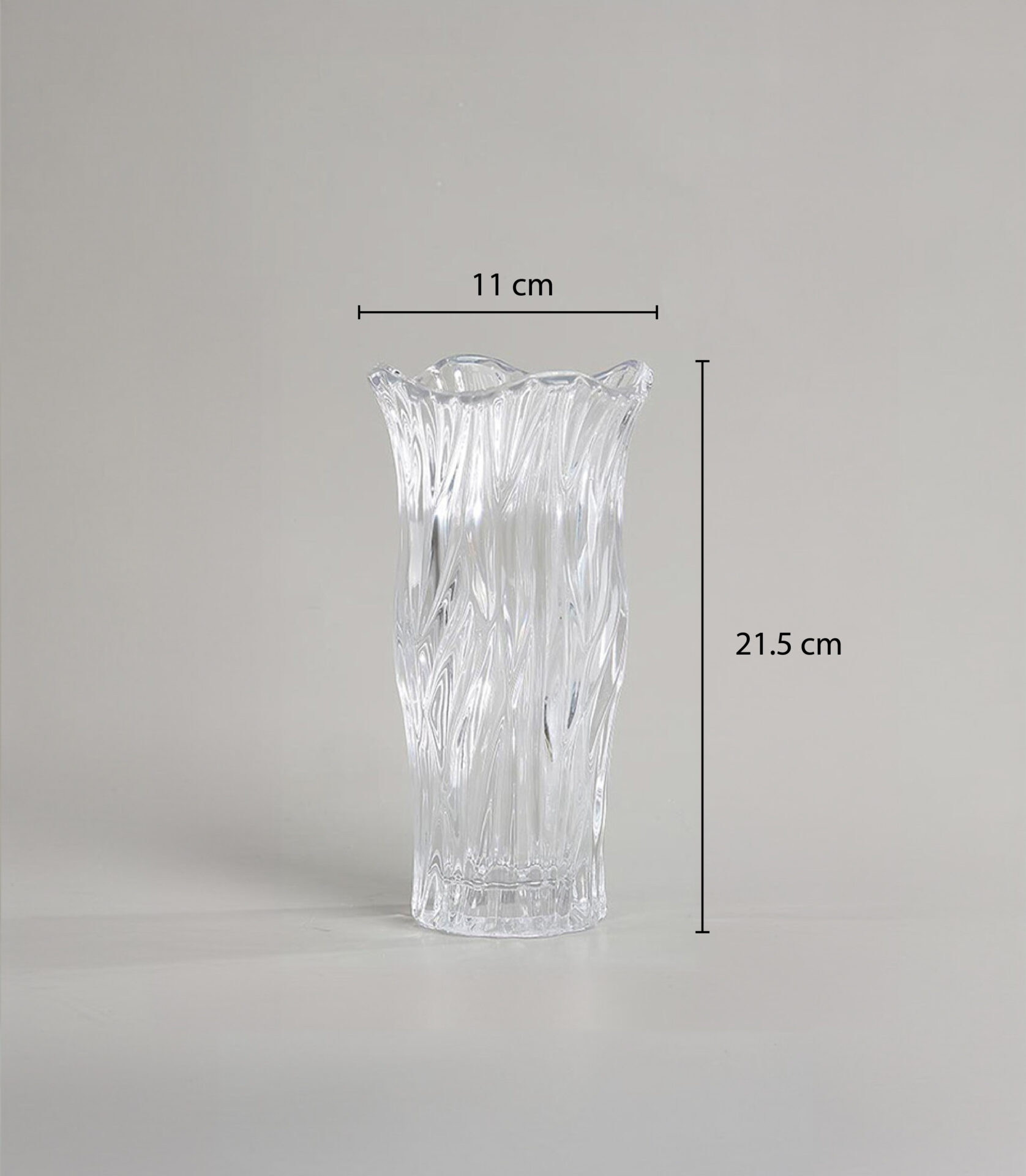 Crystal Clear Wave Glass Vase with intricate flowing wave patterns, perfect for adding elegance and sophistication to any room.