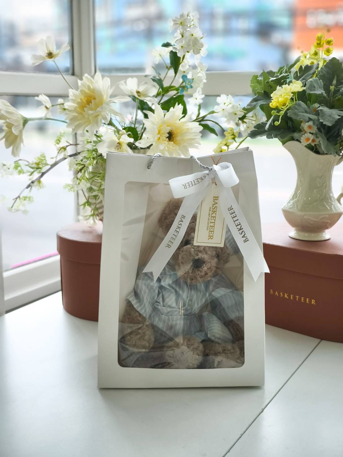 Premium teddy bear in a white gift box with ribbon, perfect for birthdays or surprises