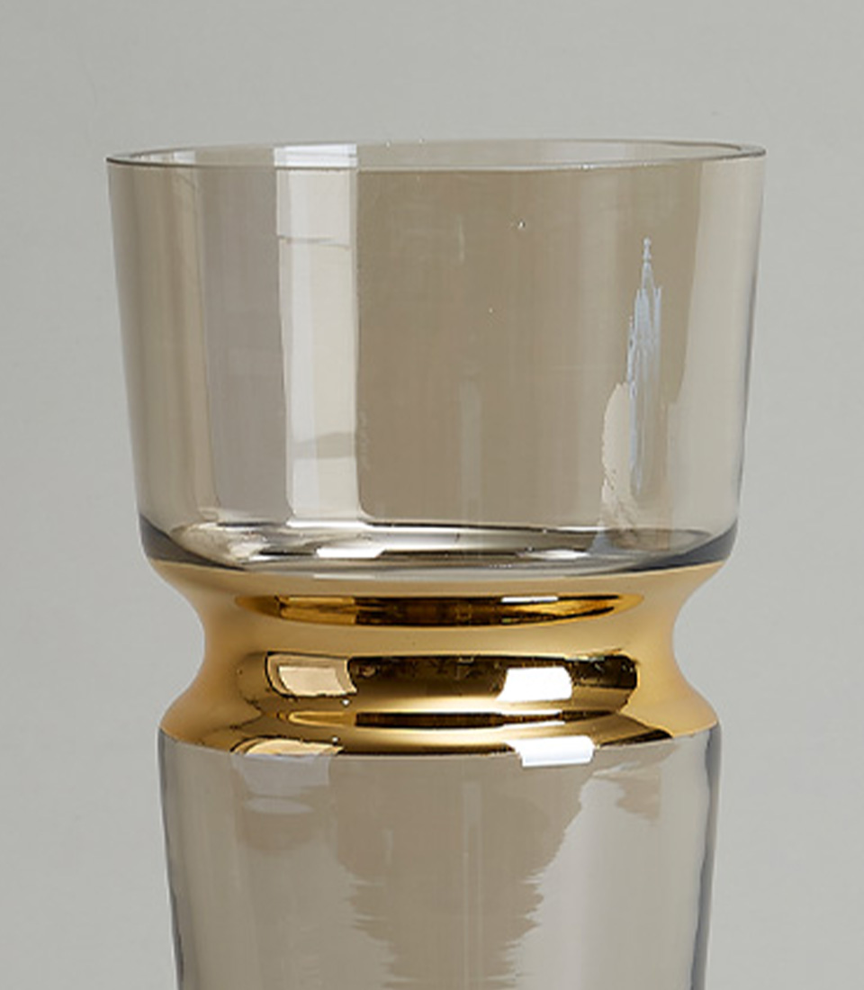 Elegant clear glass vase with a gold band around the middle, perfect for adding a touch of modern sophistication to any decor