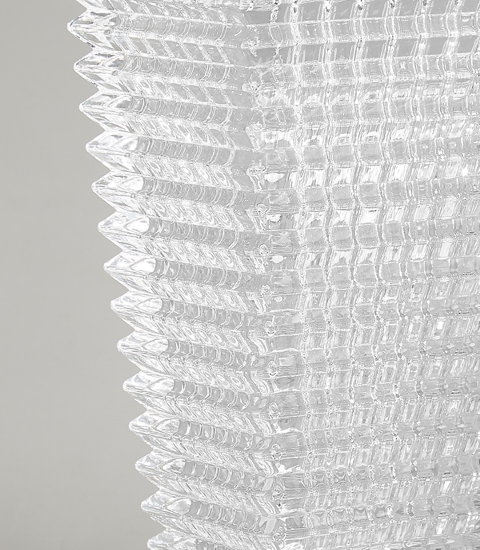Textured crystal glass rectangular vase with intricate patterns, perfect for adding modern elegance and sophistication to any decor.