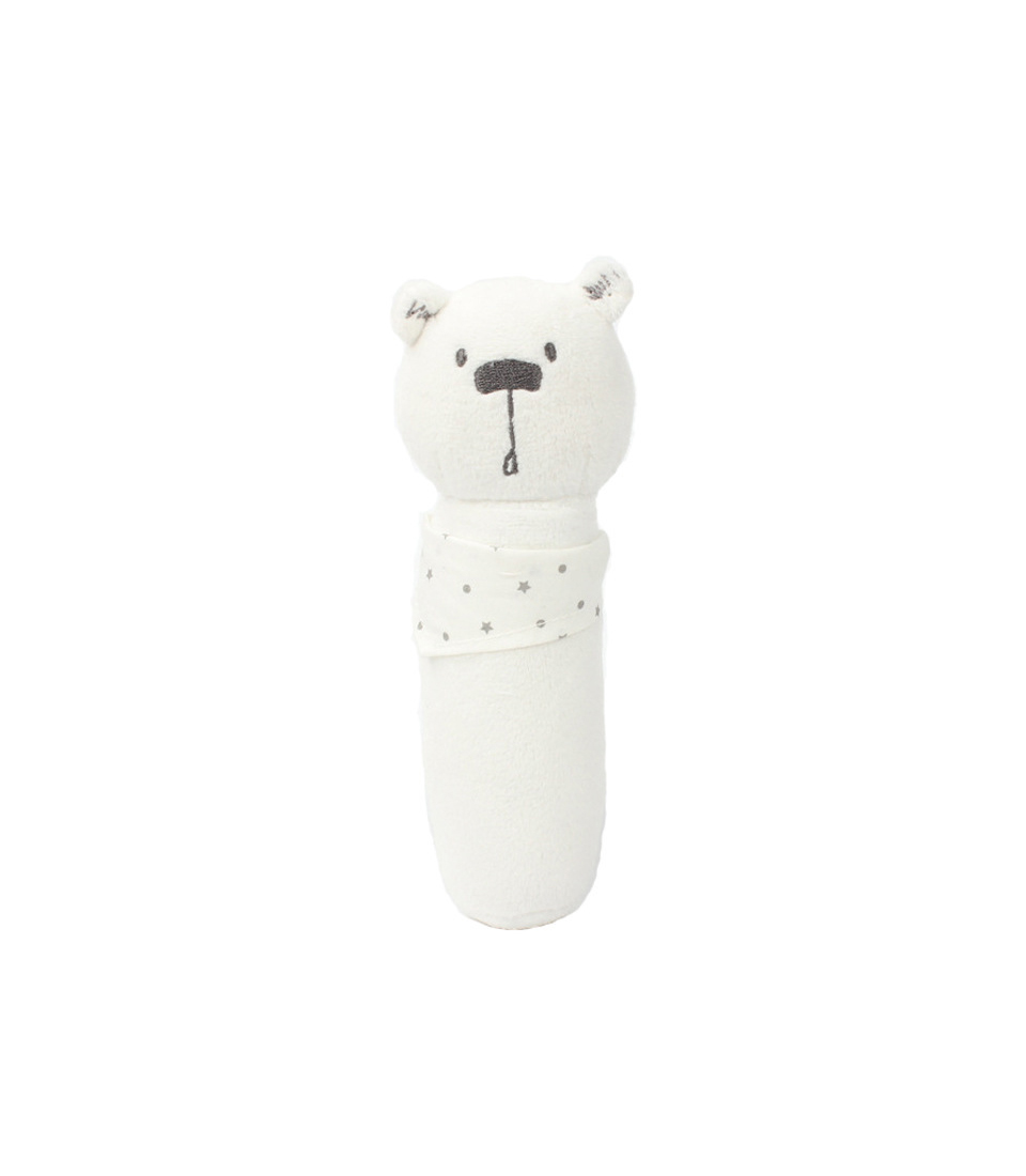 A cuddle-soft white plush rattle toy shaped like a bear. The bear has embroidered eyes and nose, and a small mouth. It wears a white scarf with small grey stars around its neck. Its cylindrical body makes it easy for a baby to grip and shake, perfect as a bolster for little hands.