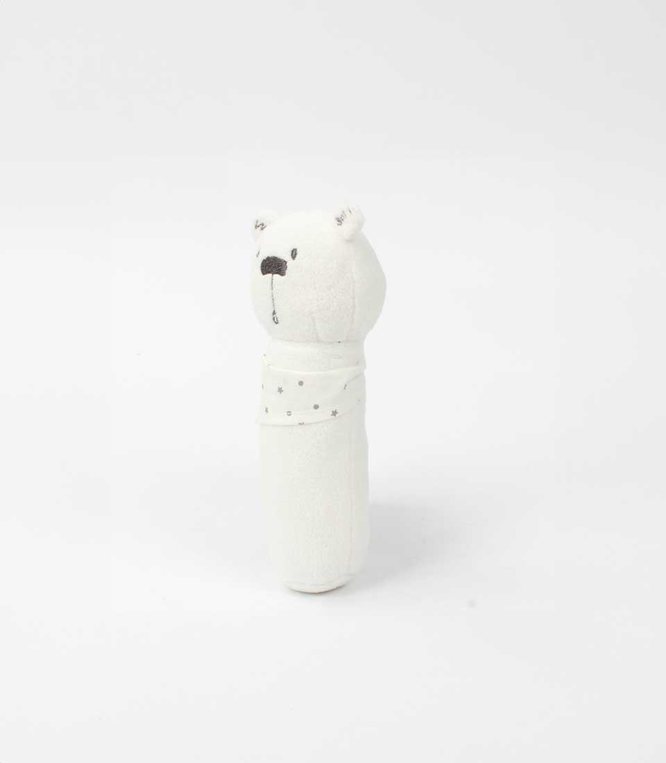 Soft white bear rattle toy featuring a star-patterned bandana on a white background.