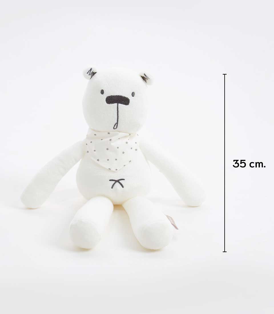 A cuddly white teddy bear with a simple embroidered face and a small black and white star scarf around its neck. This soft toy stands at 35 cm in height against a plain white background.