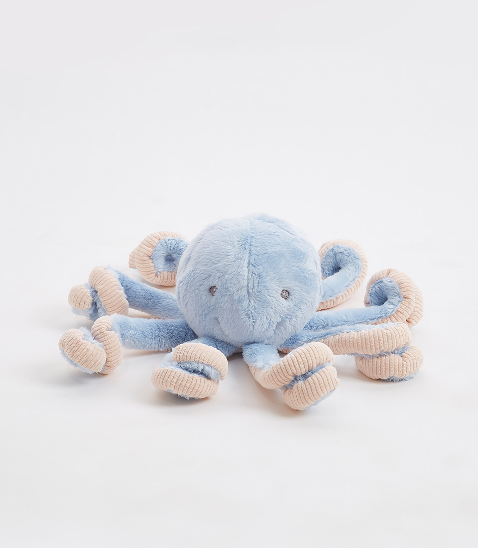 A plush octopus toy designed to look like an adorable sea creature with a soft blue body and beige spiral tentacles. The toy has small, round eyes and simple stitching, giving it a cute and cuddly appearance. Perfect for fans of soft toys, this charming octopus rests on a plain white surface.