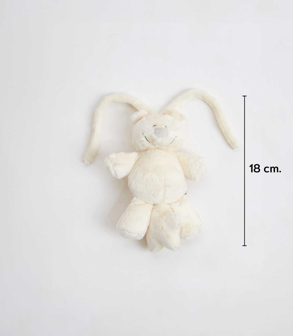 A plush stuffed bunny, white in color, with long floppy ears and a smiling face. Standing at 18 cm as indicated by a vertical arrow next to it, this cuddly companion is reminiscent of a white teddy bear. The bunny is lying on a plain white background.