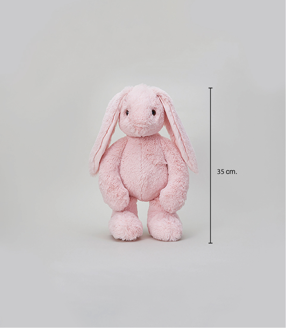 A soft pink stuffed bunny with long floppy ears and a gentle expression, standing upright, set against a light gray background, height of 35 cm.